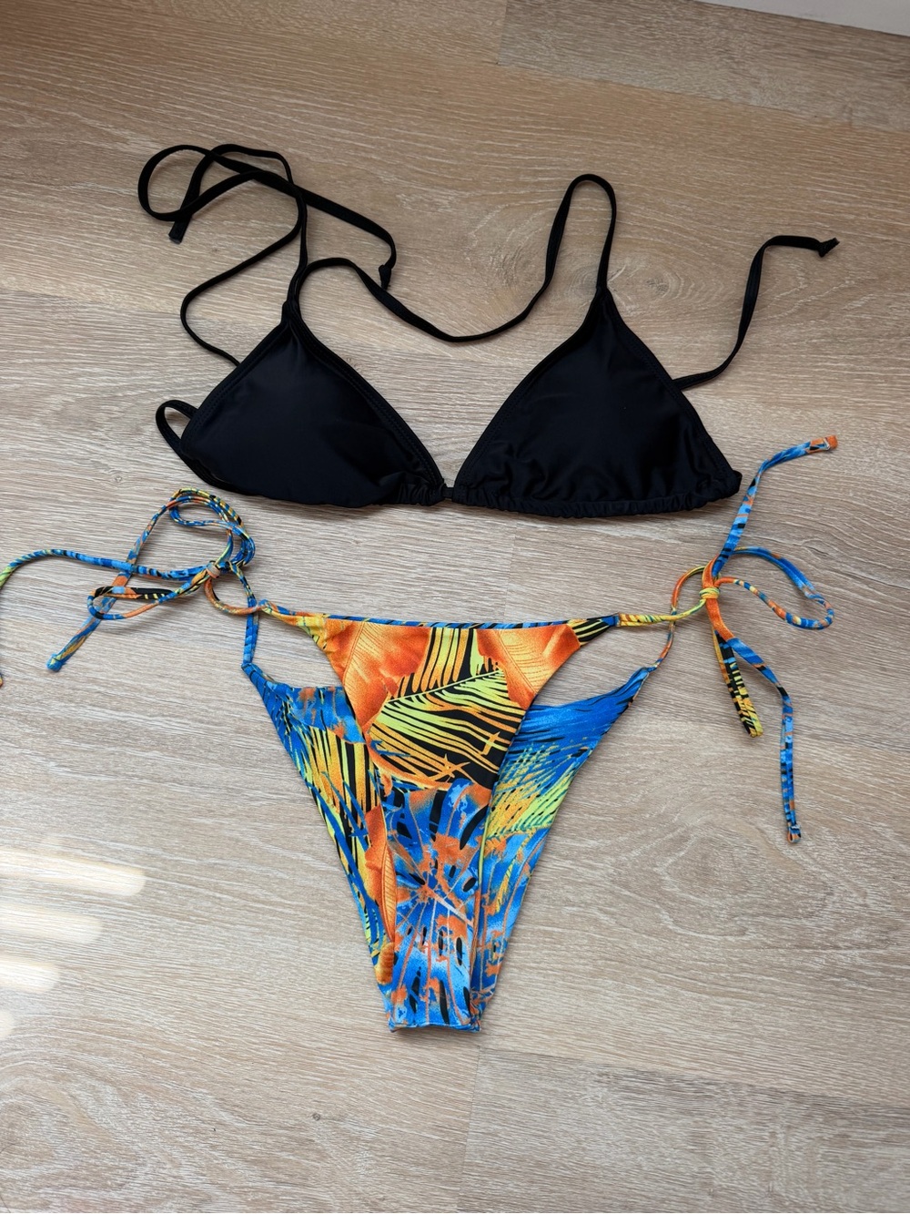 SHEIN Black Triangle Top with Orange & Blue Tropical Tie-Side Bottom